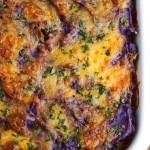 Vegetable Shepherd's pie is loaded with sauteed crimini mushrooms, chick peas, and mixed veggies. Topped with creamy purple mashed potatoes. This is our favorite fall casserole! Vegetarian.
