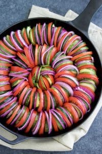 Zucchini tomato pesto bake (similar to ratatouille) is so delicious and easy to make! It's easy to be fancy with this healthy side dish recipe!