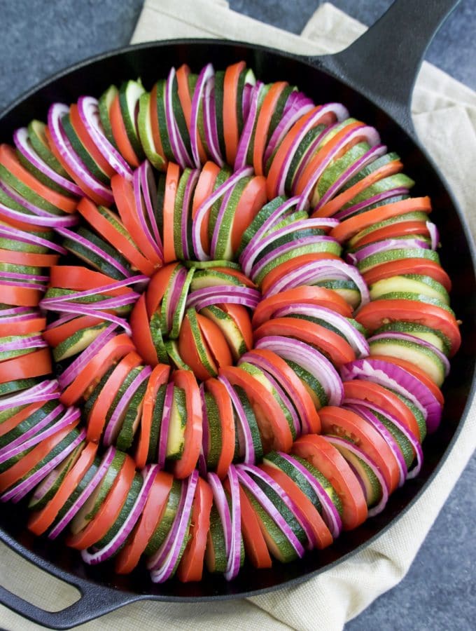 Zucchini tomato pesto bake (similar to ratatouille) is so delicious and easy to make! It's easy to be fancy with this healthy side dish recipe!