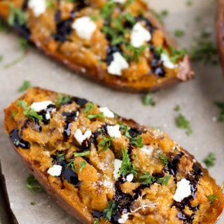 Goat cheese crumbles, sautéed balsamic onions and twice baked sweet potatoes make the perfect side dish or vegetarian dinner! #cleaneating #goatcheese #sidedish #sweetpotatoes #vegetarian