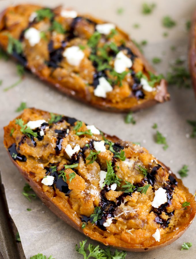 Goat cheese crumbles, sautéed balsamic onions and twice baked sweet potatoes make the perfect side dish or vegetarian dinner! #cleaneating #goatcheese #sidedish #sweetpotatoes #vegetarian