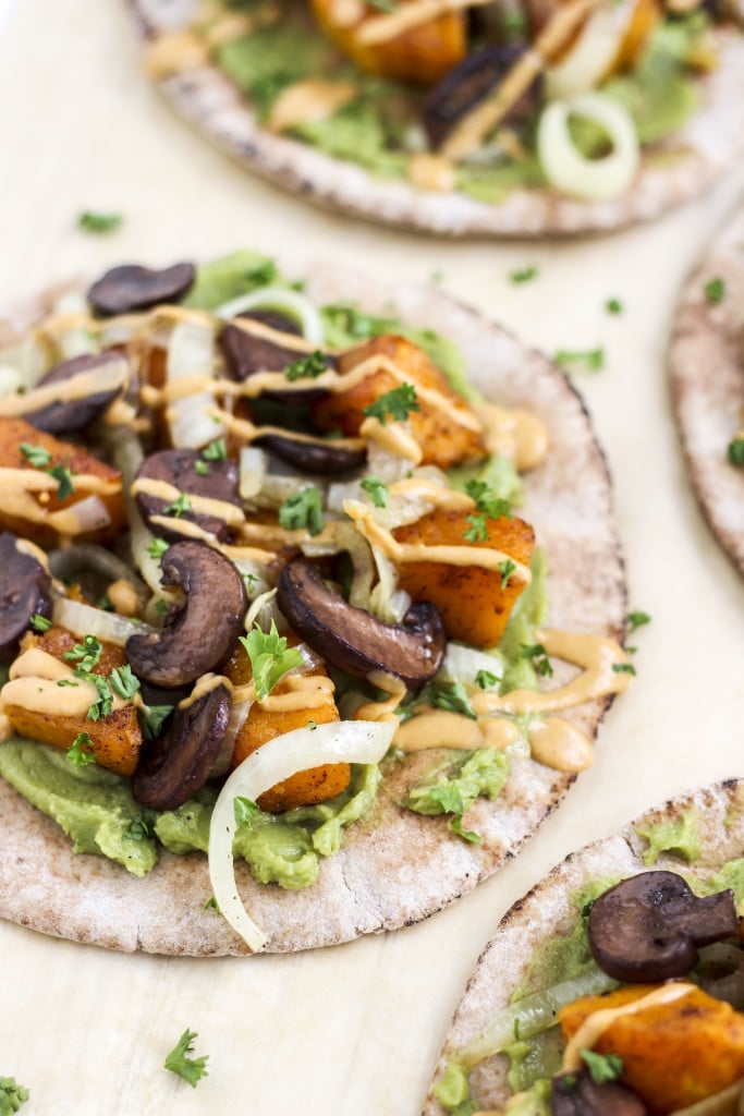 A close up view of a couple of pita wraps on a light background.