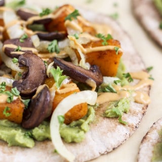 Spicy roasted butternut squash, sautéed onions, mashed avocado, and portobello mushrooms, on a pita, with a chipotle yogurt sauce.