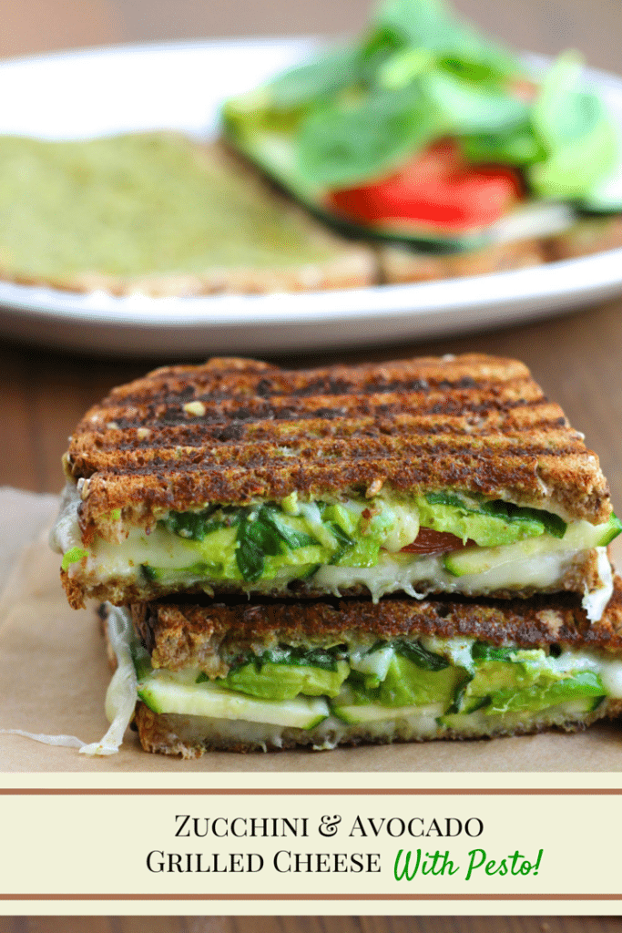 A vegan grilled cheese sandwich cut in half and stacked on top of each other with a white plate behind it on a rustic background.