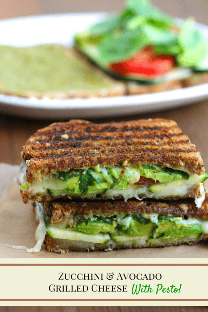 A vegan grilled cheese sandwich cut in half and stacked on top of each other with a white plate behind it on a rustic background. 