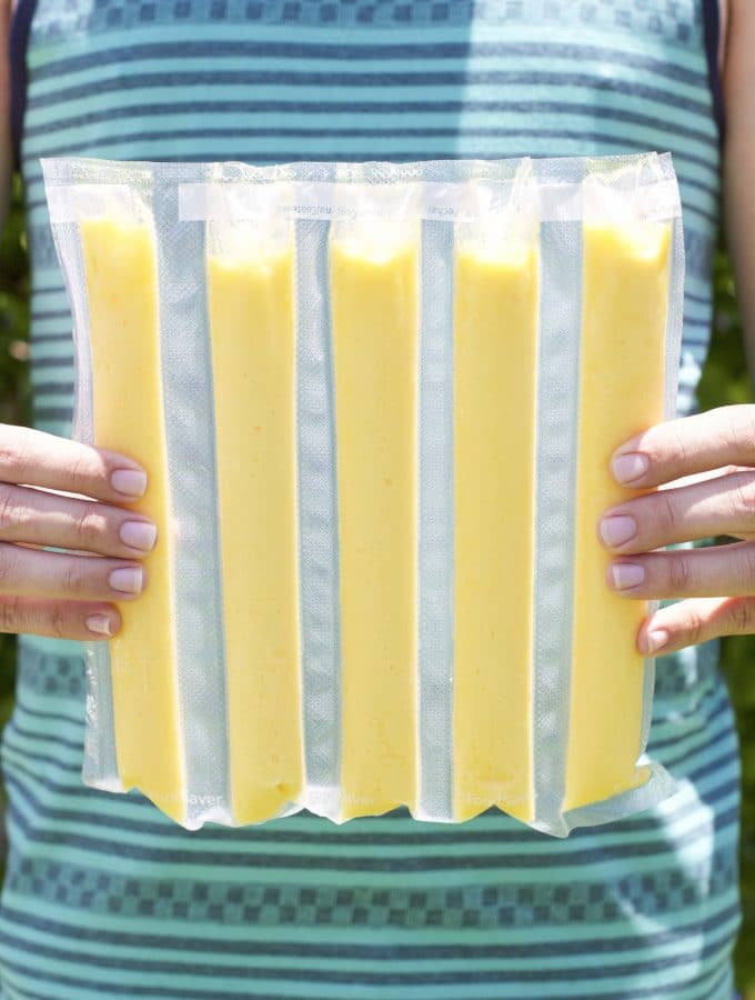 Make your own mango popsicles with only 2 wholesome ingredients! These popsicles are refined sugar free and require only a few minutes to assemble using a FoodSaver vacuum. The perfect summer treat that everyone will love and you can feel good about eating! Dairy-free.