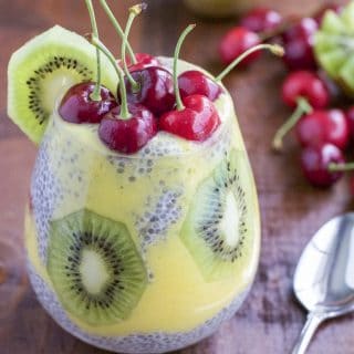 Protein and fiber rich chia seed pudding layered with sweet coconut mango puree, fresh kiwi and topped with juicy cherries. You can make this for breakfast, a snack or for dessert! Dairy-free.