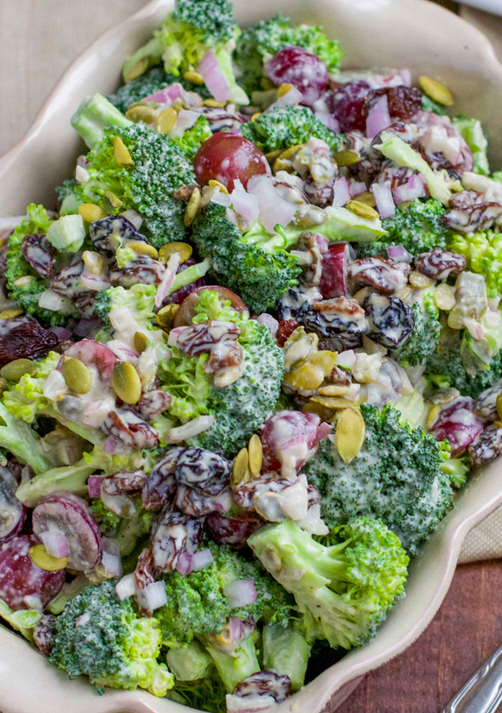 A casserole dish filled with broccoli salad.