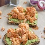 Spice up your plain avocado toast breakfast by adding last night's leftover buffalo cauliflower on top! Buffalo cauliflower avocado toast will be your new go-to! Vegan and dairy-free.