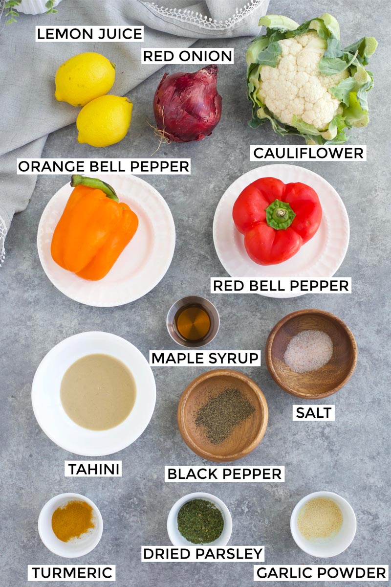 All of the ingredients needed to make the recipe laid out on a gray background. 