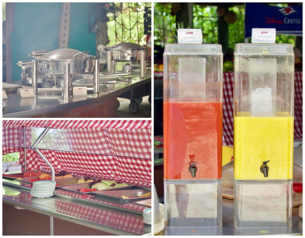 Food in hot trays, fresh fruit, and gazpacho on the buffet at Cookie's BBQ at Castaway Cay. 