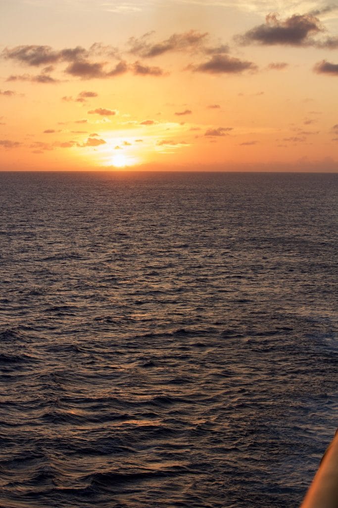 A view of the sunset over the water from a Disney cruise. 