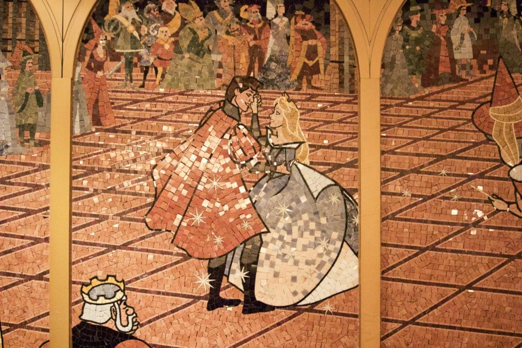 Tile mosaic of Sleeping Beauty and prince dancing at Royal Court on Disney cruise. 