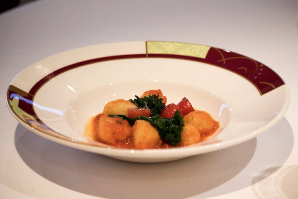 A bowl filled with gnocchi at dinner at Palo on the Disney Fantasy.