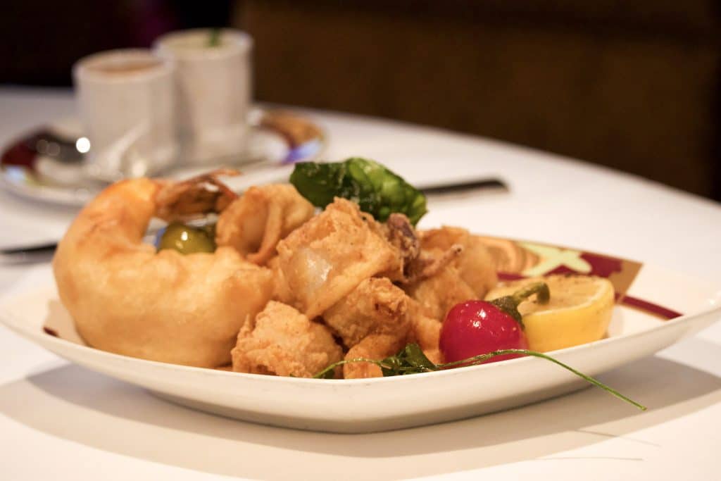 Fried shrimp and calamari on a plate at dinner at Palo. 