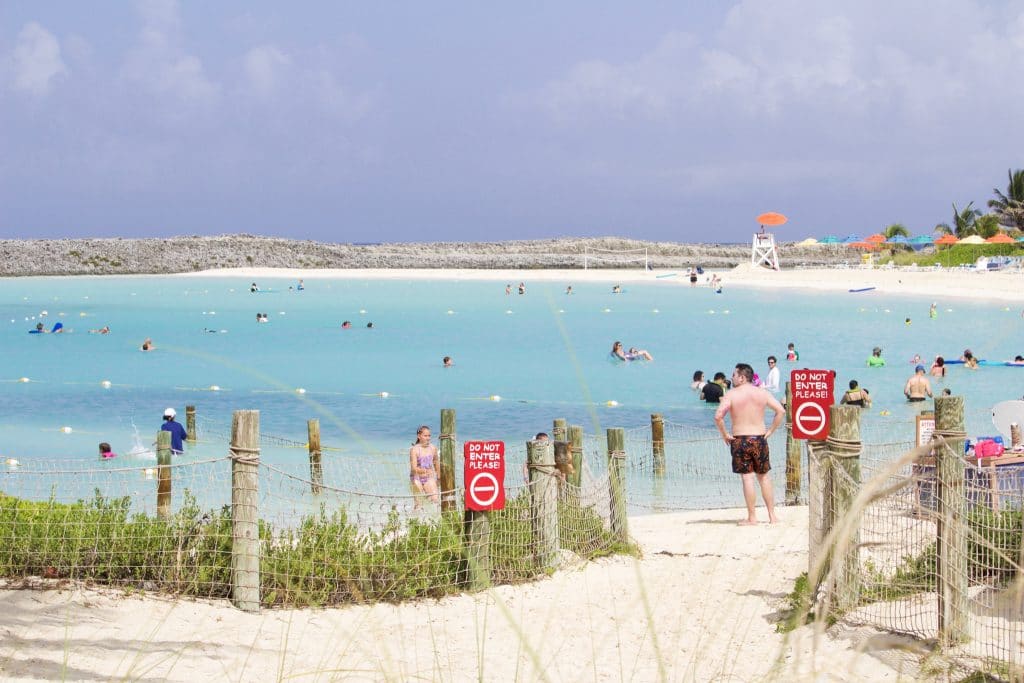 People snorkeling in the snorkeling lagoon on the family side of Castaway Cay. 