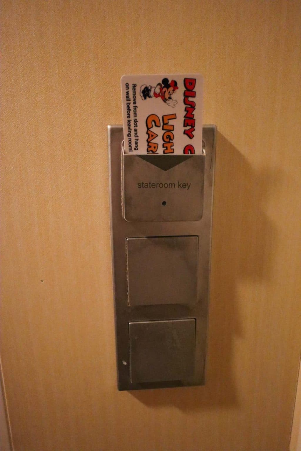 A card sticking in the light switch onboard a Disney cruise. 