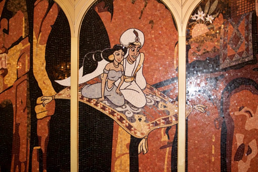 Tile mosaic of Aladdin and Jasmine flying on a magic carpet at the Royal Court restaurant. 