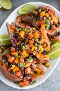 This 5-min vegan rainbow salsa recipe is seriously addicting! I put it on tacos, in quinoa salads, eat it like dip with chips, or just out of the container if no one is looking! My mom always told me to eat the rainbow! Gluten-free.