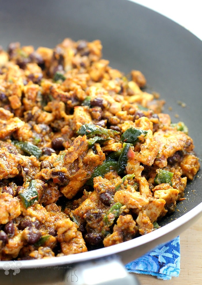 Low-carb vegan sofritos in a large skillet resting on a table top.