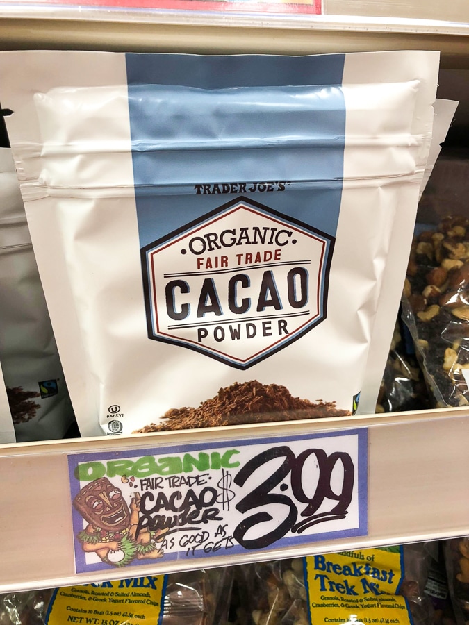 A bag of organic cacao for $3.99 on a shelf at Trader Joe's. 