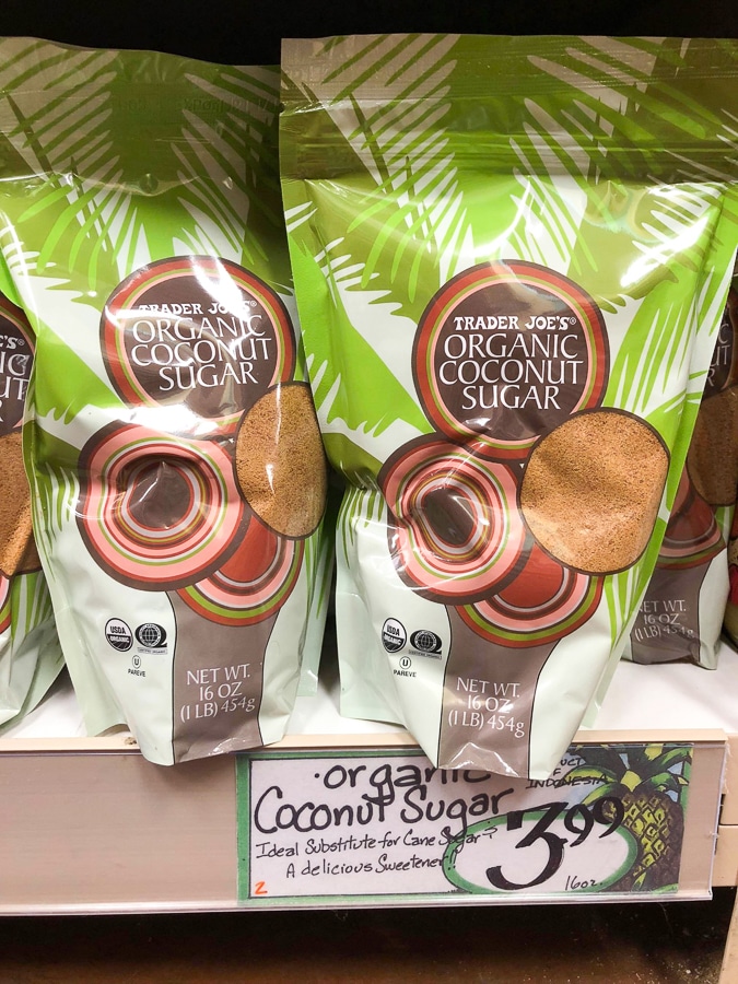 Two bags of organic coconut sugar on a shelf at Trader Joe's. 