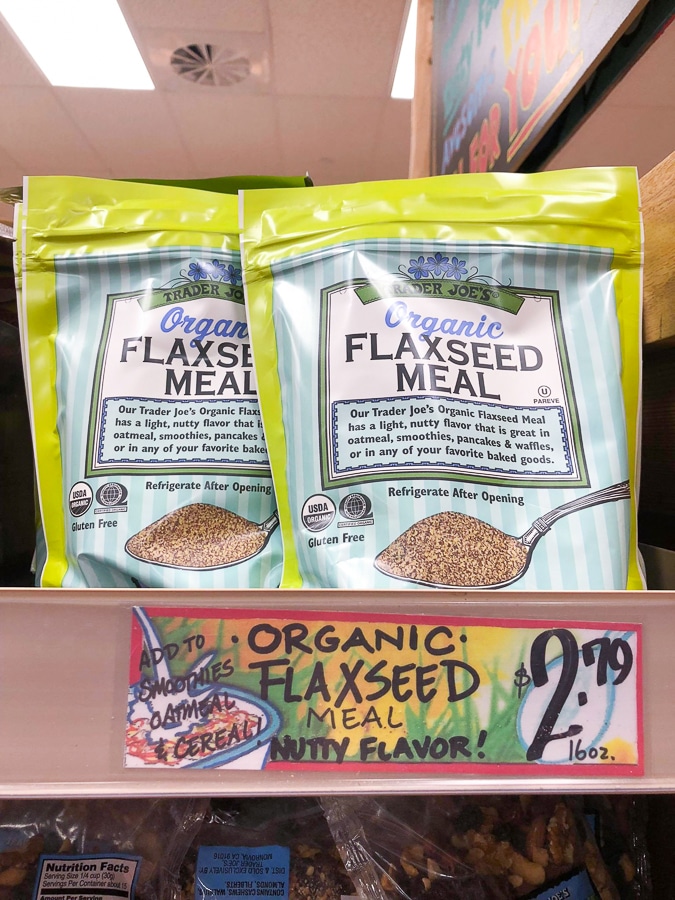 A bag of organic flaxseed meal for $2.79 on a shelf at Trader Joe's. 