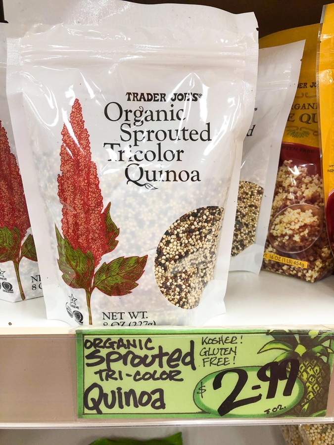 A bag of organic sprouted tricolor quinoa for $2.99 on a shelf at Trader Joe's. 