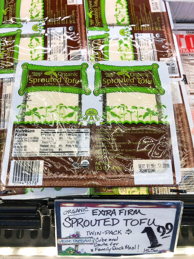 A package of organic sprouted tofu for $1.99 on a shelf at Trader Joe's. 