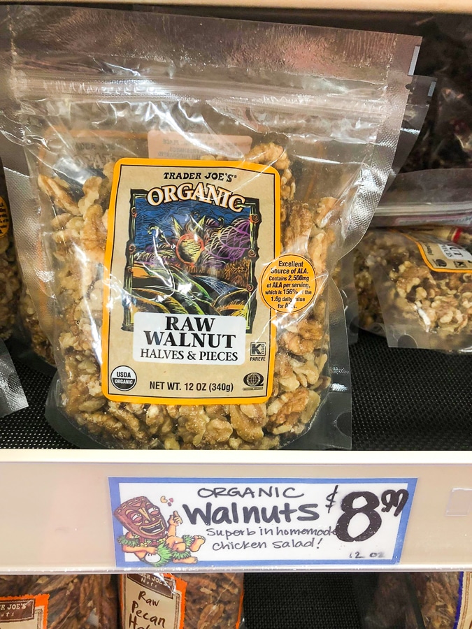 A bag of organic raw walnuts for $8.99 on a shelf at Trader Joe's. 