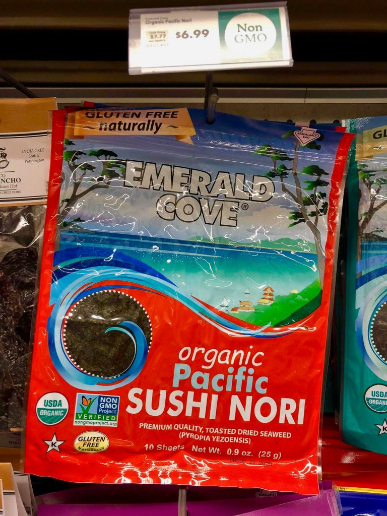 A package of organic nori sheets hanging on a rack at Whole Foods.