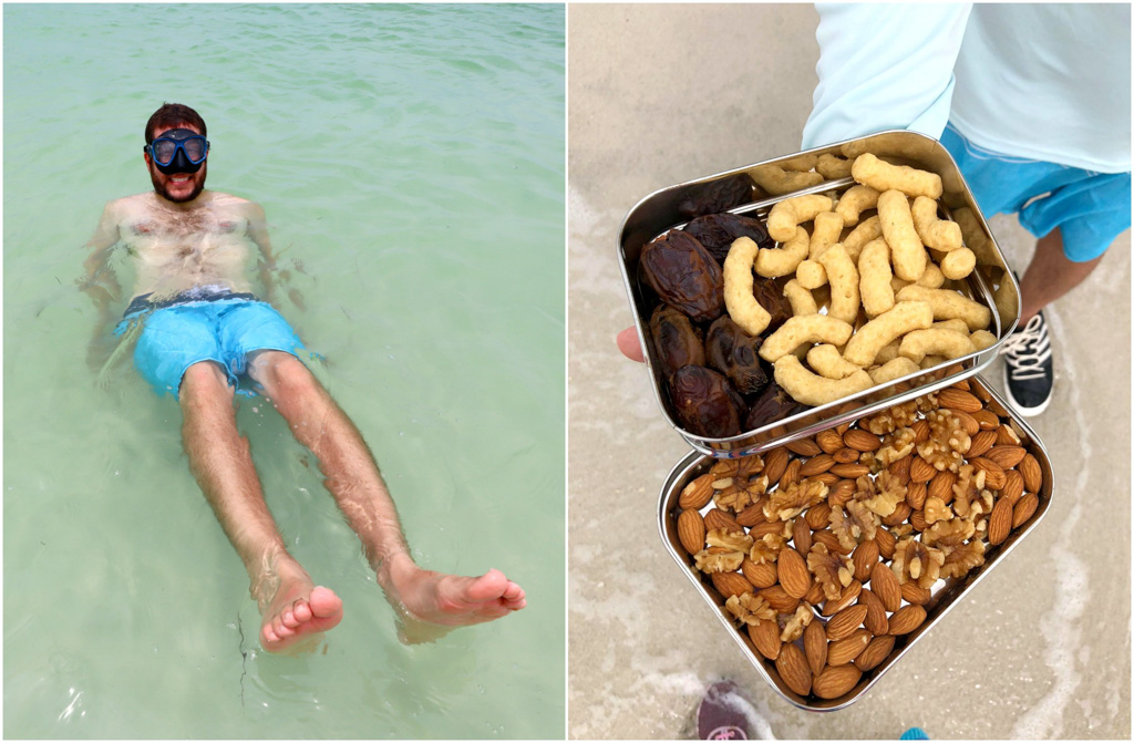 A man snorkeling in the water and eating snacks from a bento box at Caladesi Island. 