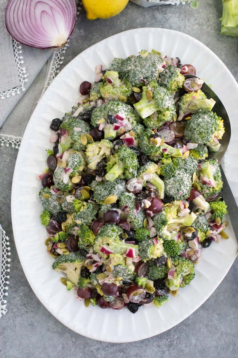 A white platter filled with vegetables on a gray background. 