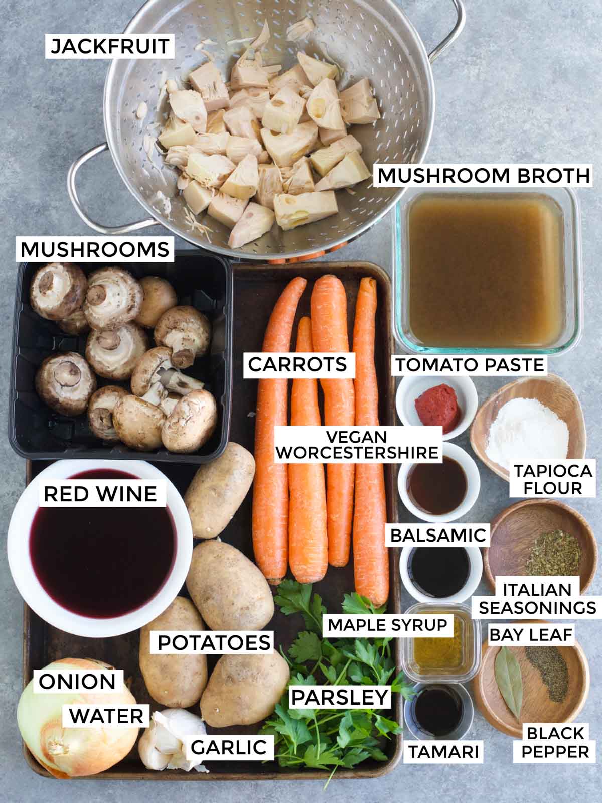 All of the ingredients needed to make the recipe are laid out on a gray background.