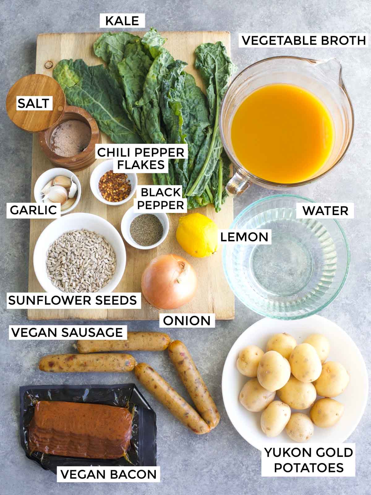 All of the ingredients needed to make the recipe are labeled and laid out on a gray background.